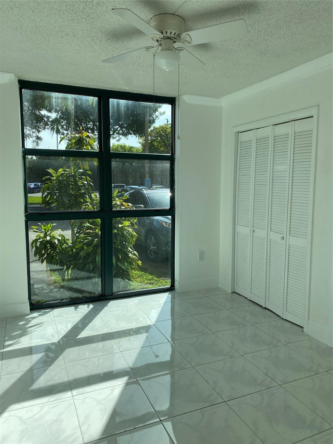 11790 Southwest 18th Street, Unit 106 Miami, FL 33175 - Photo 14 of 23 a view of room with window and furniture