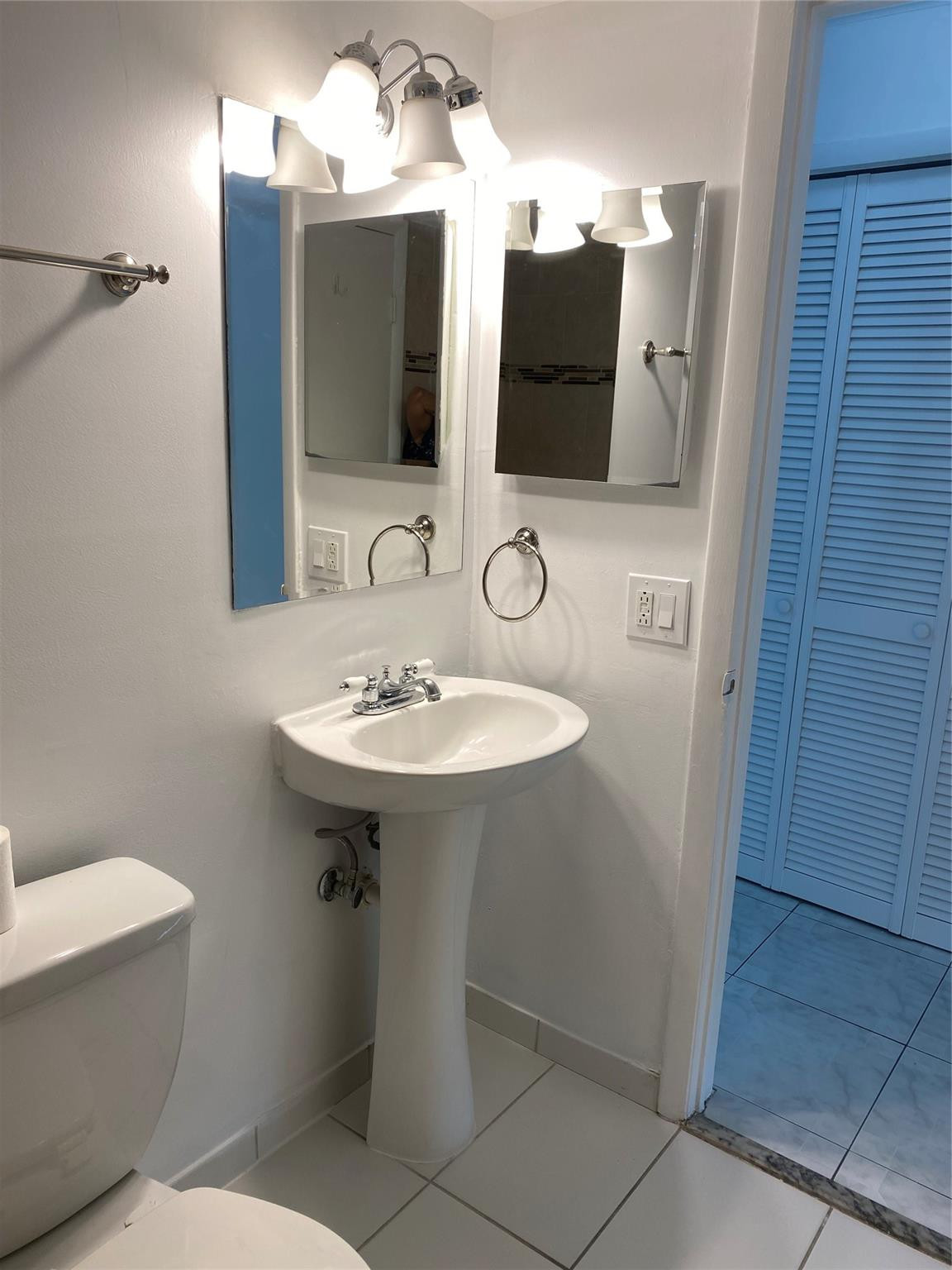 11790 Southwest 18th Street, Unit 106 Miami, FL 33175 - Photo 15 of 23 a bathroom with a toilet sink and mirror