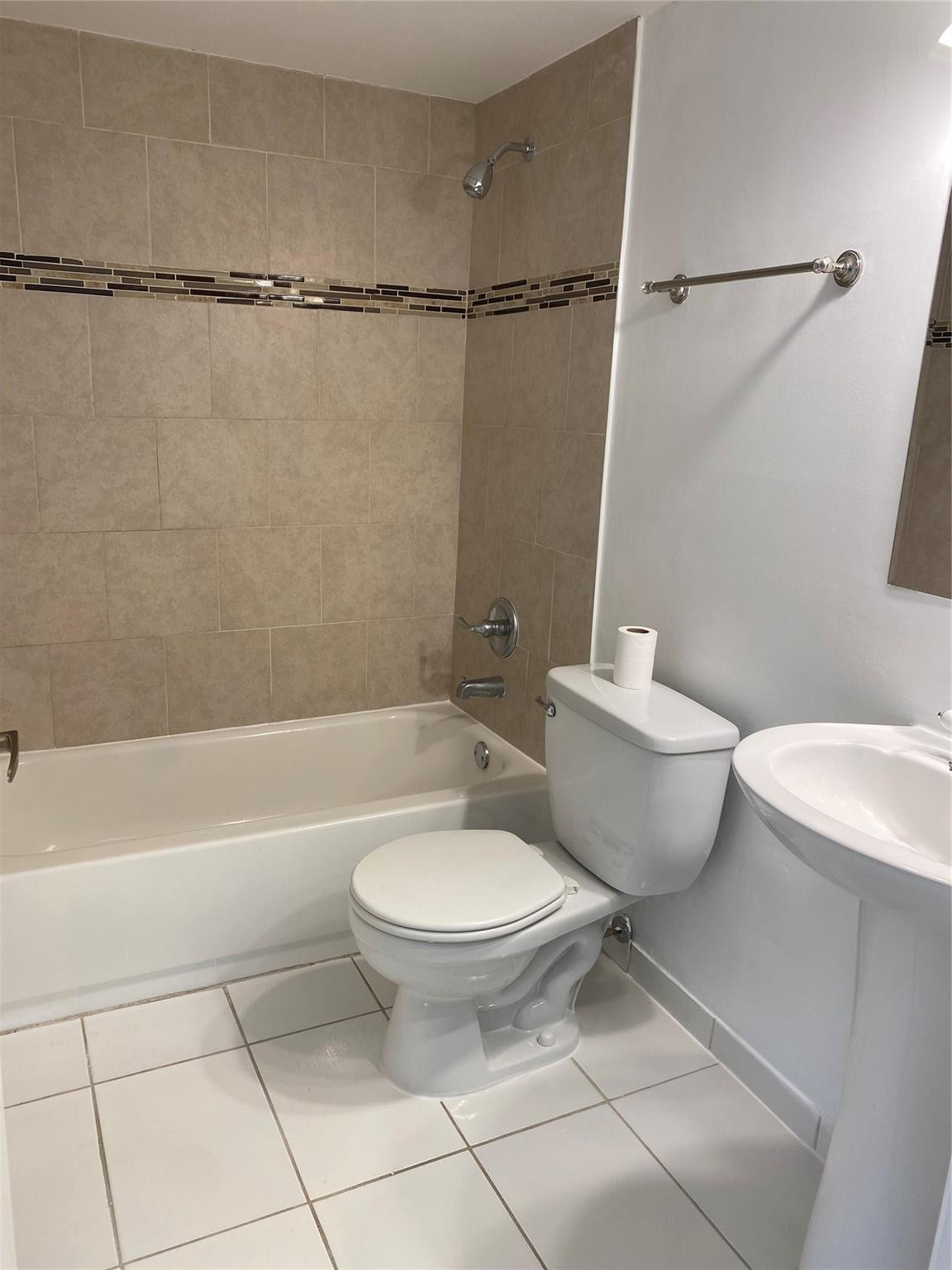 11790 Southwest 18th Street, Unit 106 Miami, FL 33175 - Photo 16 of 23 a bathroom with a toilet a sink and a shower