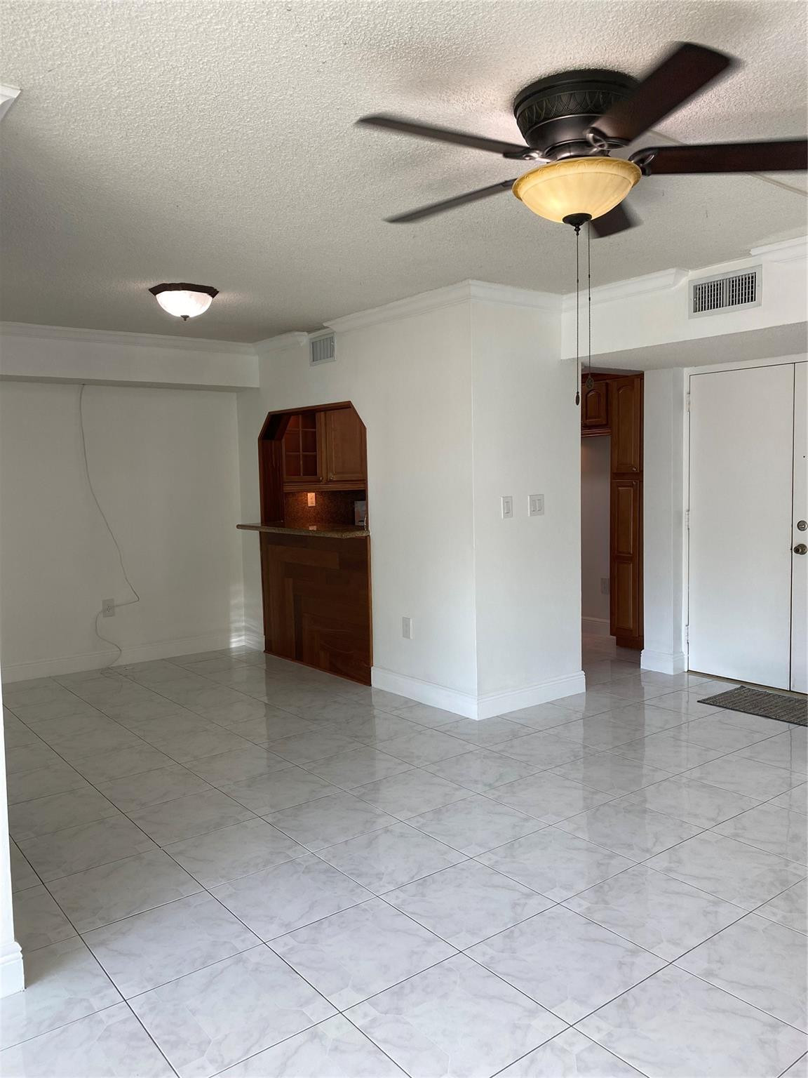 11790 Southwest 18th Street, Unit 106 Miami, FL 33175 - Photo 5 of 23 a view of a hallway with a chandelier