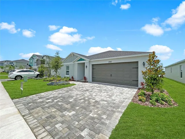 a view of a house with outdoor space and ocean view