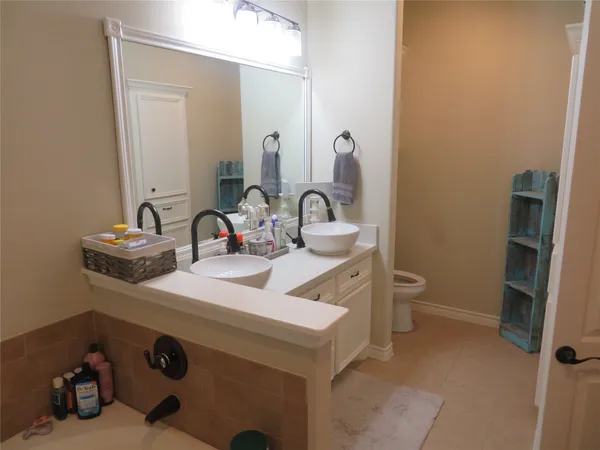 a bathroom with a sink and a toilet