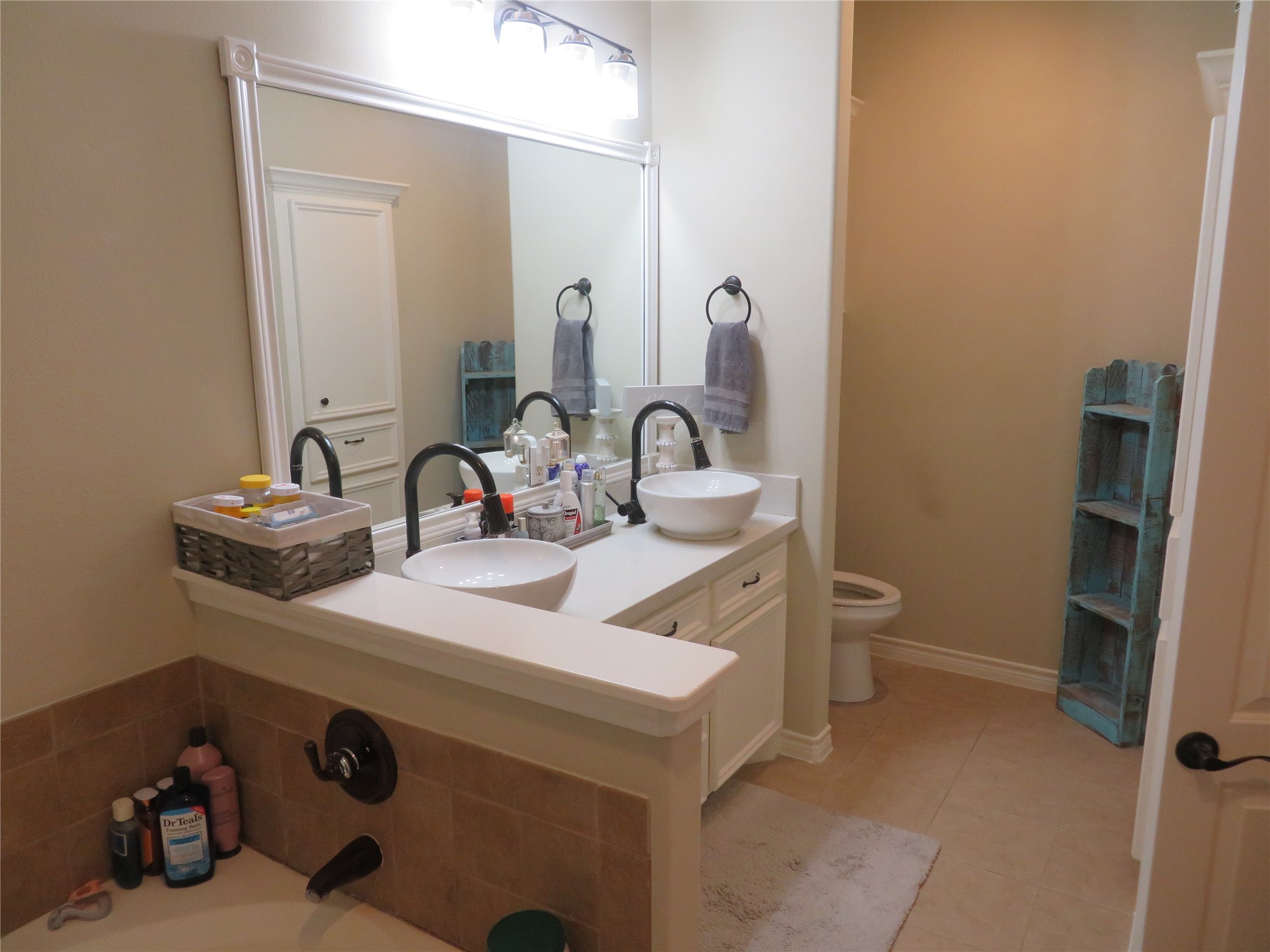 422 East Hunting Tower Run Conroe, TX 77316 - Photo 12 of 20 a bathroom with a sink and a toilet