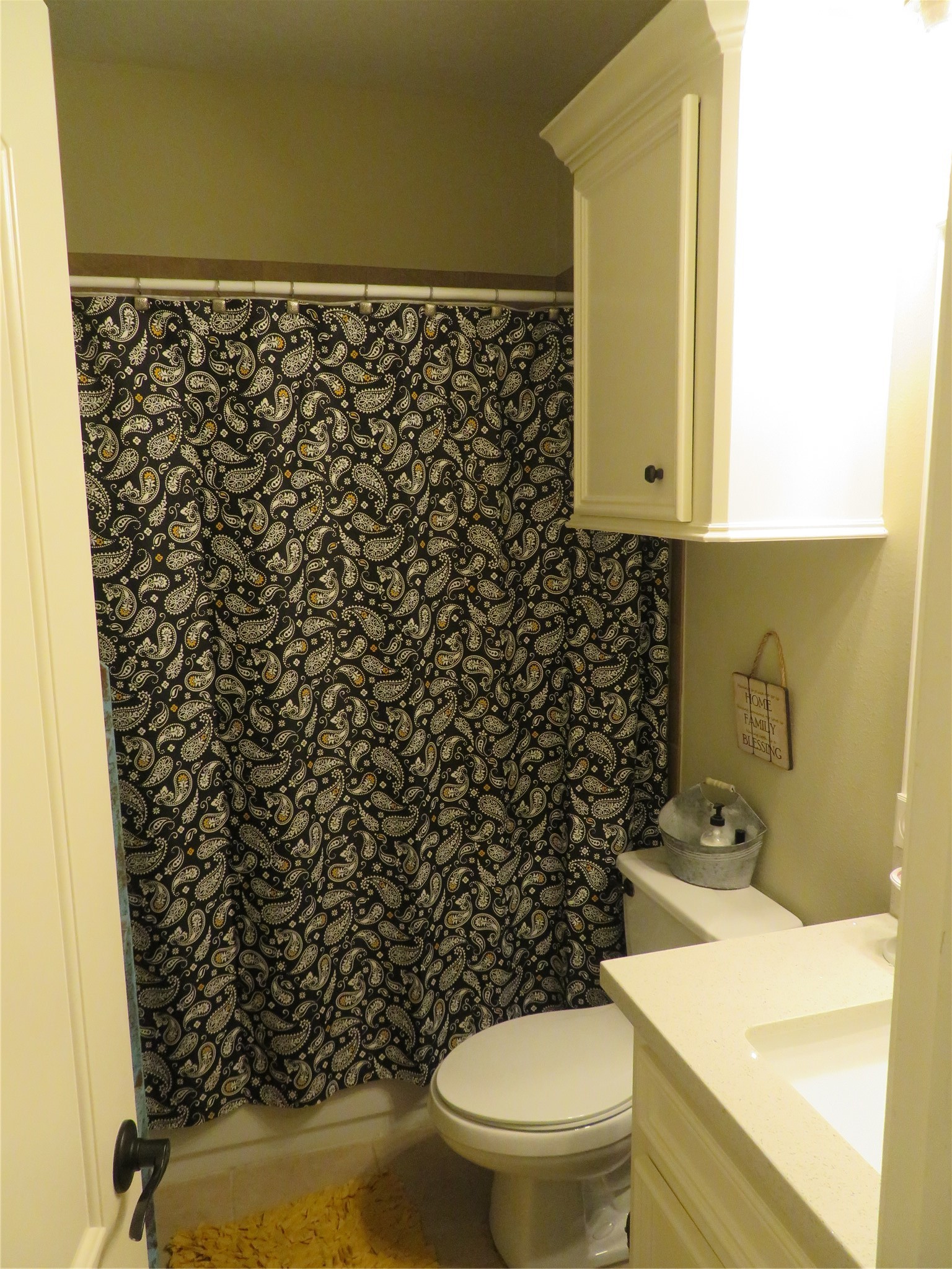 422 East Hunting Tower Run Conroe, TX 77316 - Photo 16 of 20 a bathroom with a toilet and a shower curtain