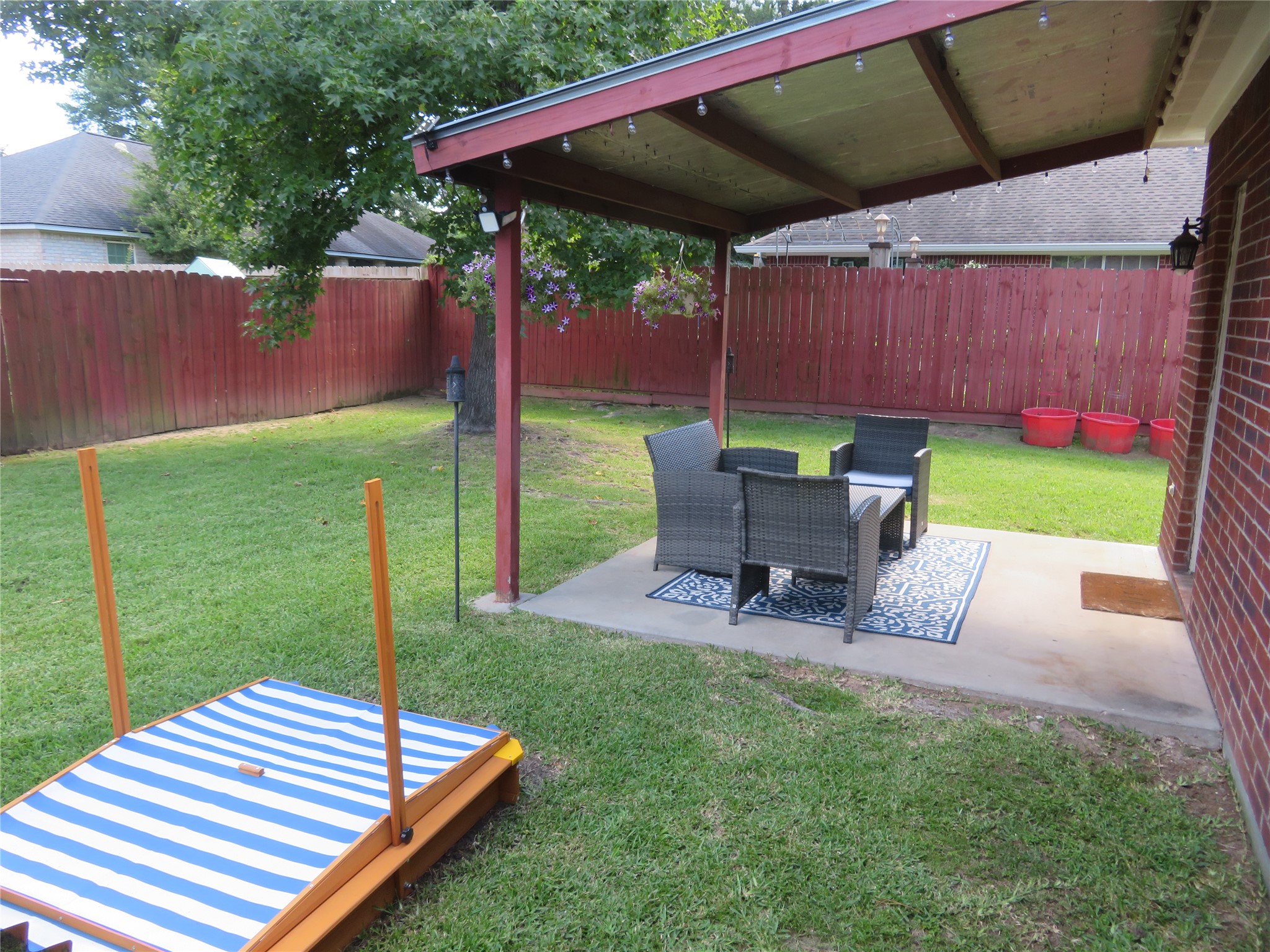 422 East Hunting Tower Run Conroe, TX 77316 - Photo 18 of 20 a wooden bench sitting in the middle of a yard