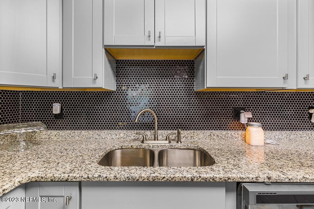 8490 Walden Road Jacksonville, FL 32244 - Photo 13 of 34 a kitchen with a sink and a wooden cabinets