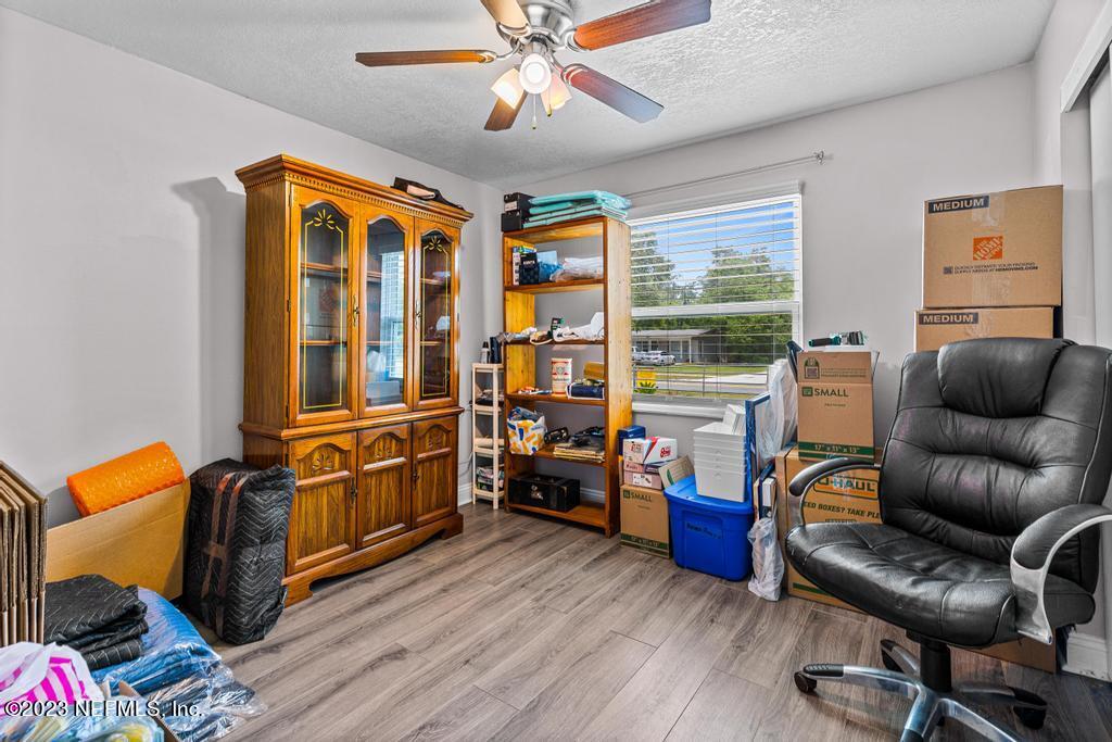 8490 Walden Road Jacksonville, FL 32244 - Photo 16 of 34 a living room with furniture and wooden floor