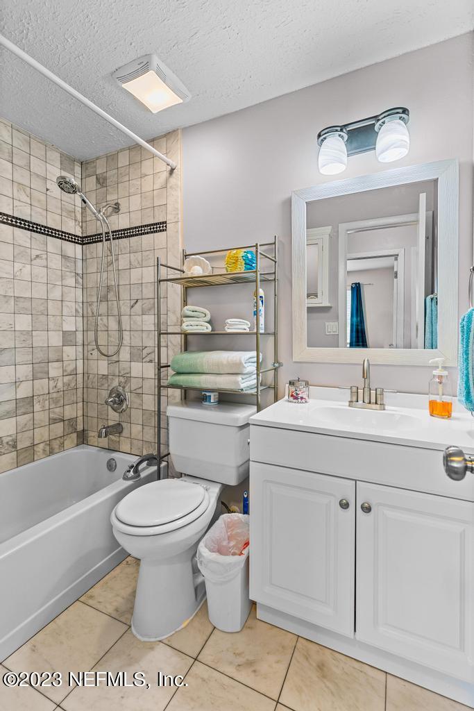 8490 Walden Road Jacksonville, FL 32244 - Photo 17 of 34 a bathroom with a sink toilet and shower