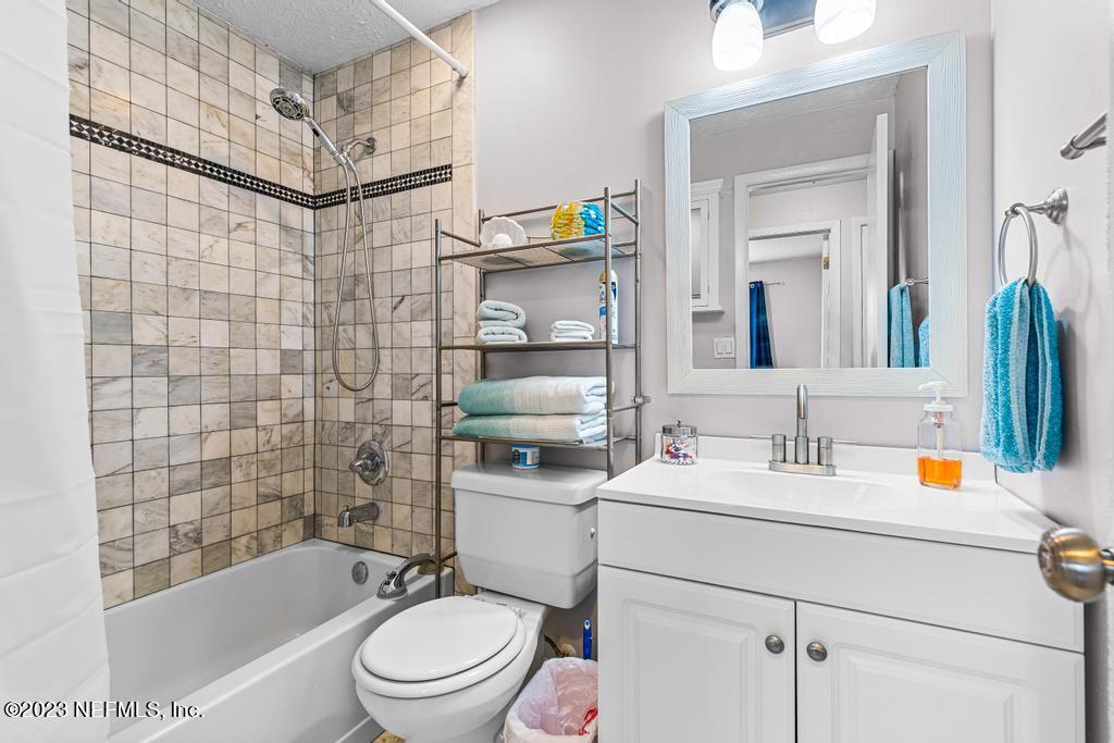 8490 Walden Road Jacksonville, FL 32244 - Photo 18 of 34 a bathroom with a sink a toilet and shower