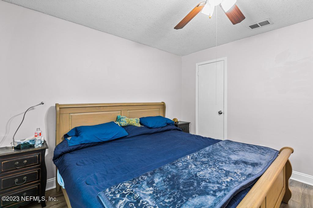 8490 Walden Road Jacksonville, FL 32244 - Photo 23 of 34 a bedroom with a bed and dresser