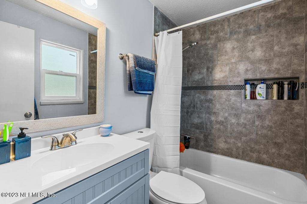 8490 Walden Road Jacksonville, FL 32244 - Photo 24 of 34 a bathroom with a sink toilet and shower