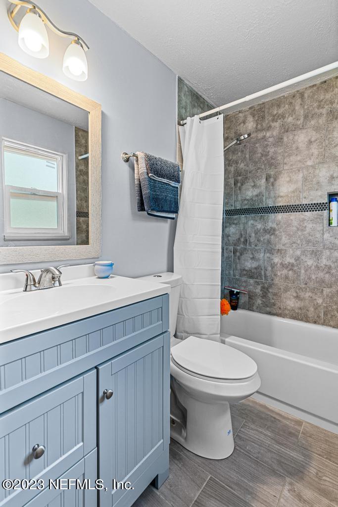 8490 Walden Road Jacksonville, FL 32244 - Photo 25 of 34 a bathroom with a sink toilet and shower
