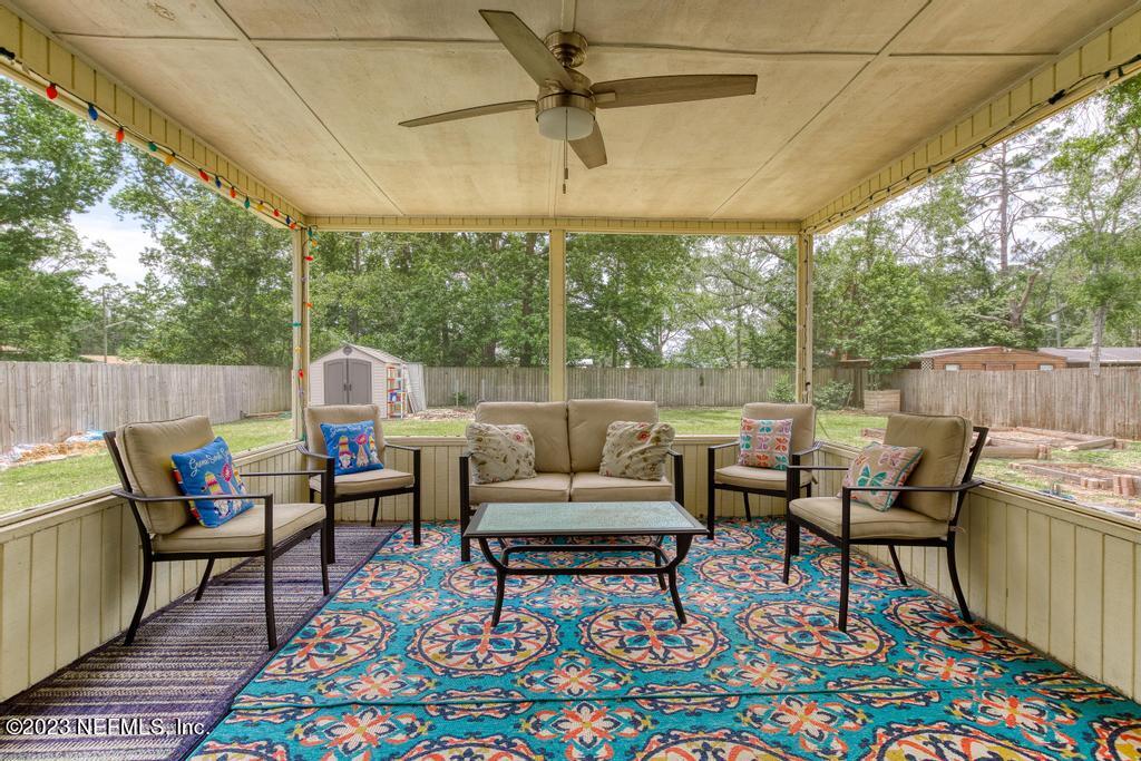 8490 Walden Road Jacksonville, FL 32244 - Photo 26 of 34 a outdoor living space with furniture and a rug