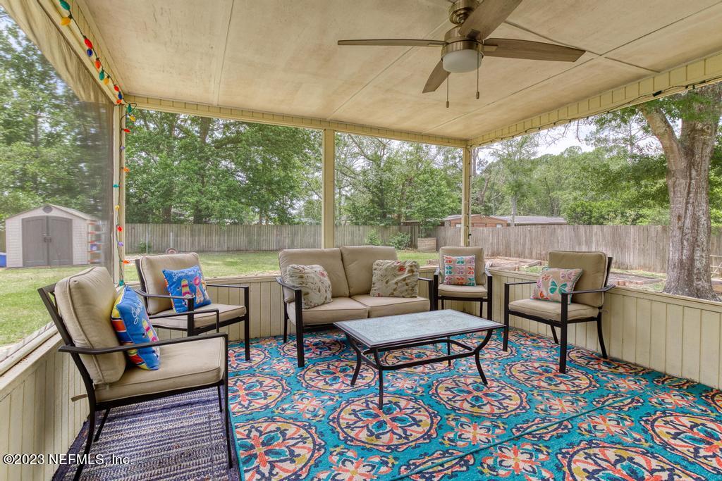 8490 Walden Road Jacksonville, FL 32244 - Photo 27 of 34 a outdoor living space with furniture and garden view