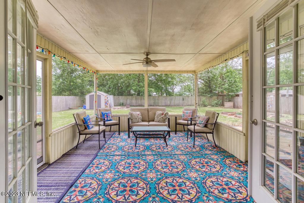 8490 Walden Road Jacksonville, FL 32244 - Photo 28 of 34 a living room with furniture and a table