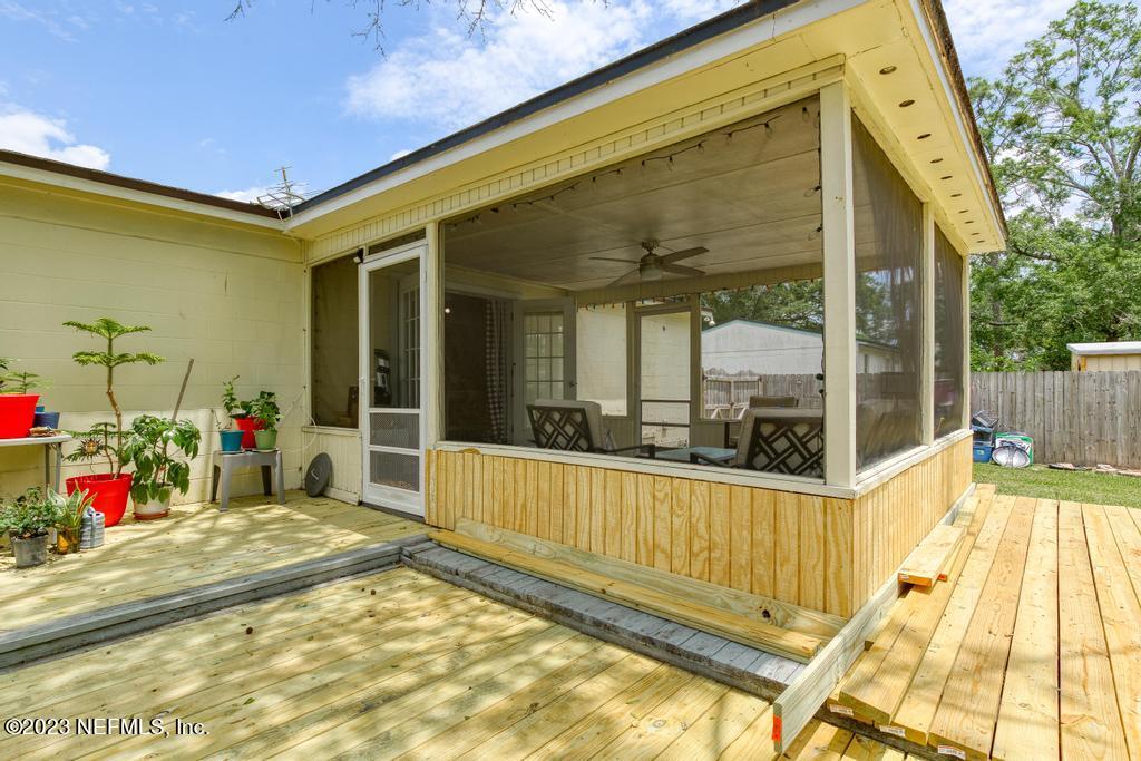8490 Walden Road Jacksonville, FL 32244 - Photo 29 of 34 a view of a swimming pool with a porch