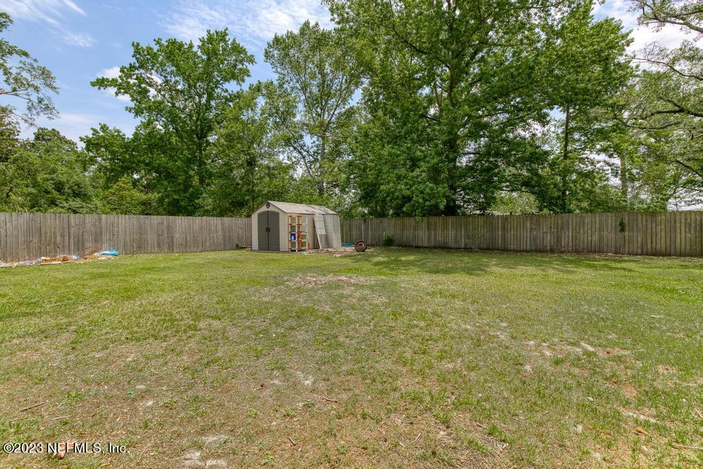 8490 Walden Road Jacksonville, FL 32244 - Photo 30 of 34 a house view with swimming pool in front of it