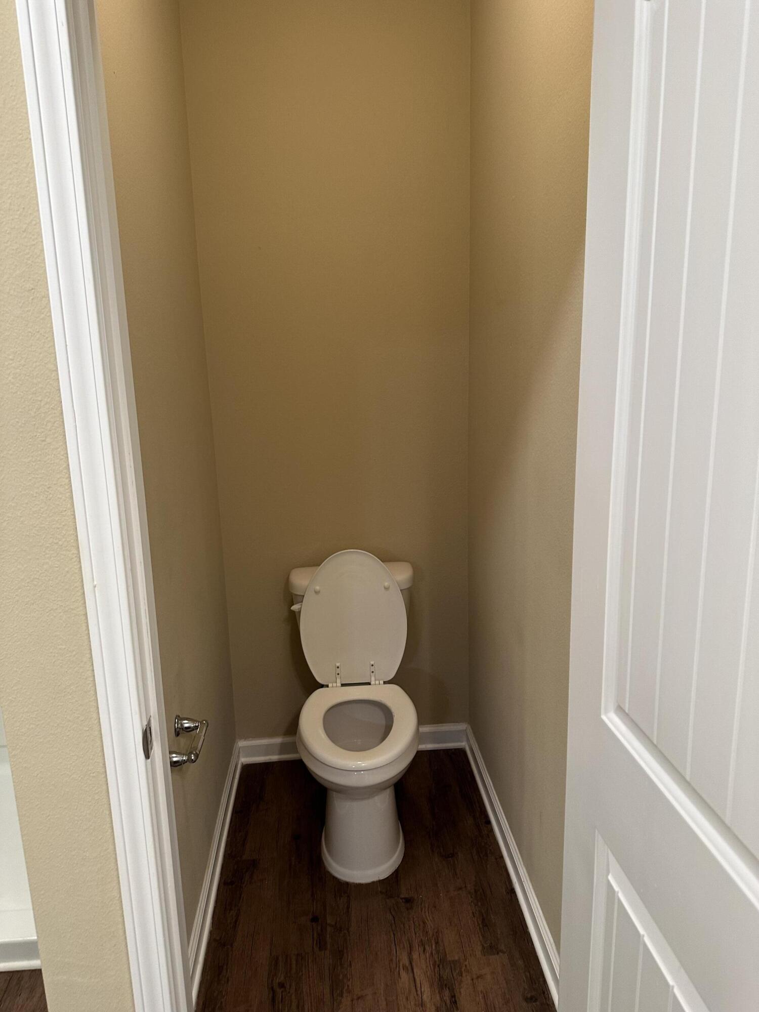 260 Cornelia Street Freeport, FL 32439 - Photo 19 of 31 a toilet sitting in a bathroom next to a sink