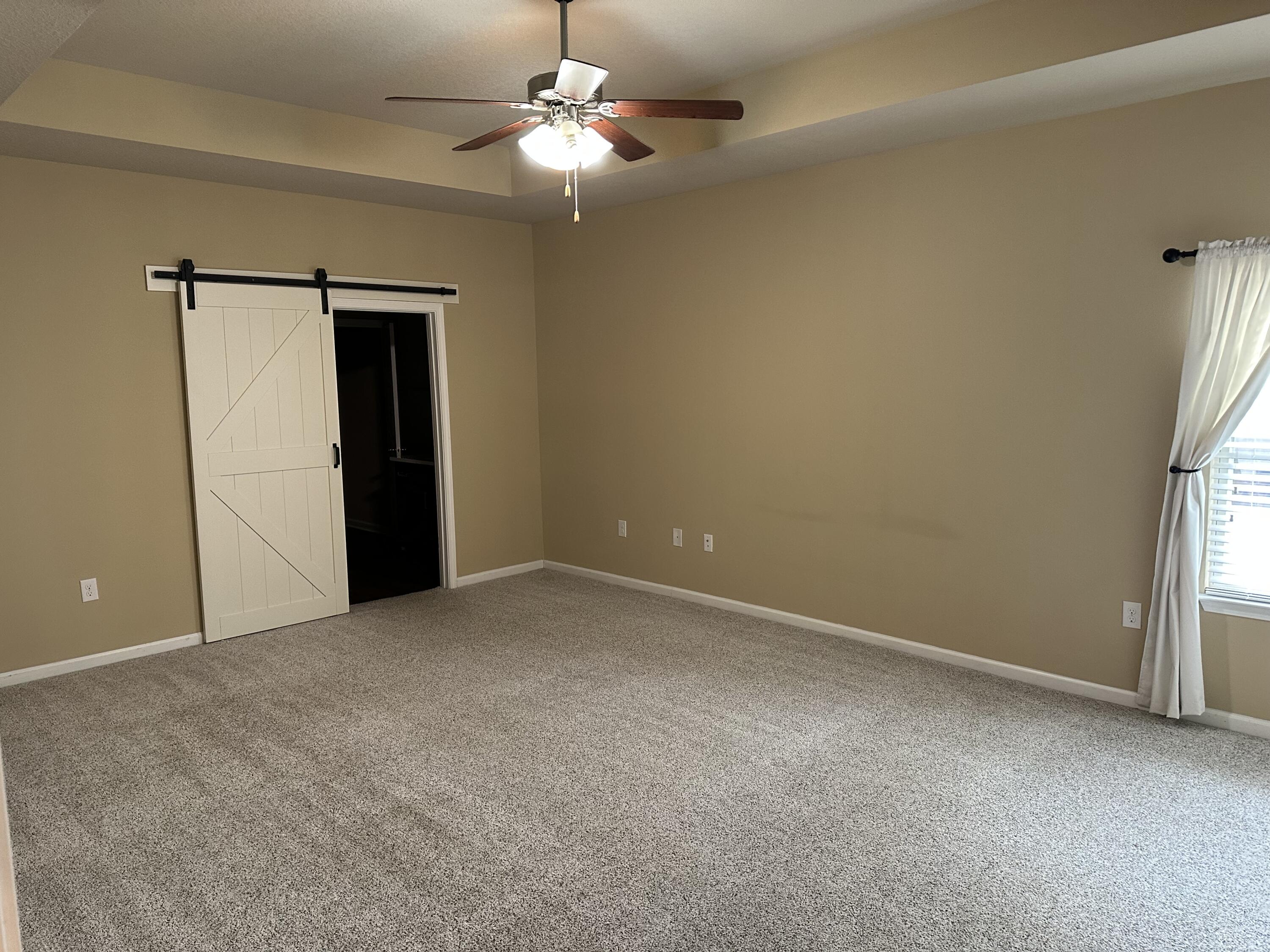 260 Cornelia Street Freeport, FL 32439 - Photo 24 of 31 an empty room with windows and fan