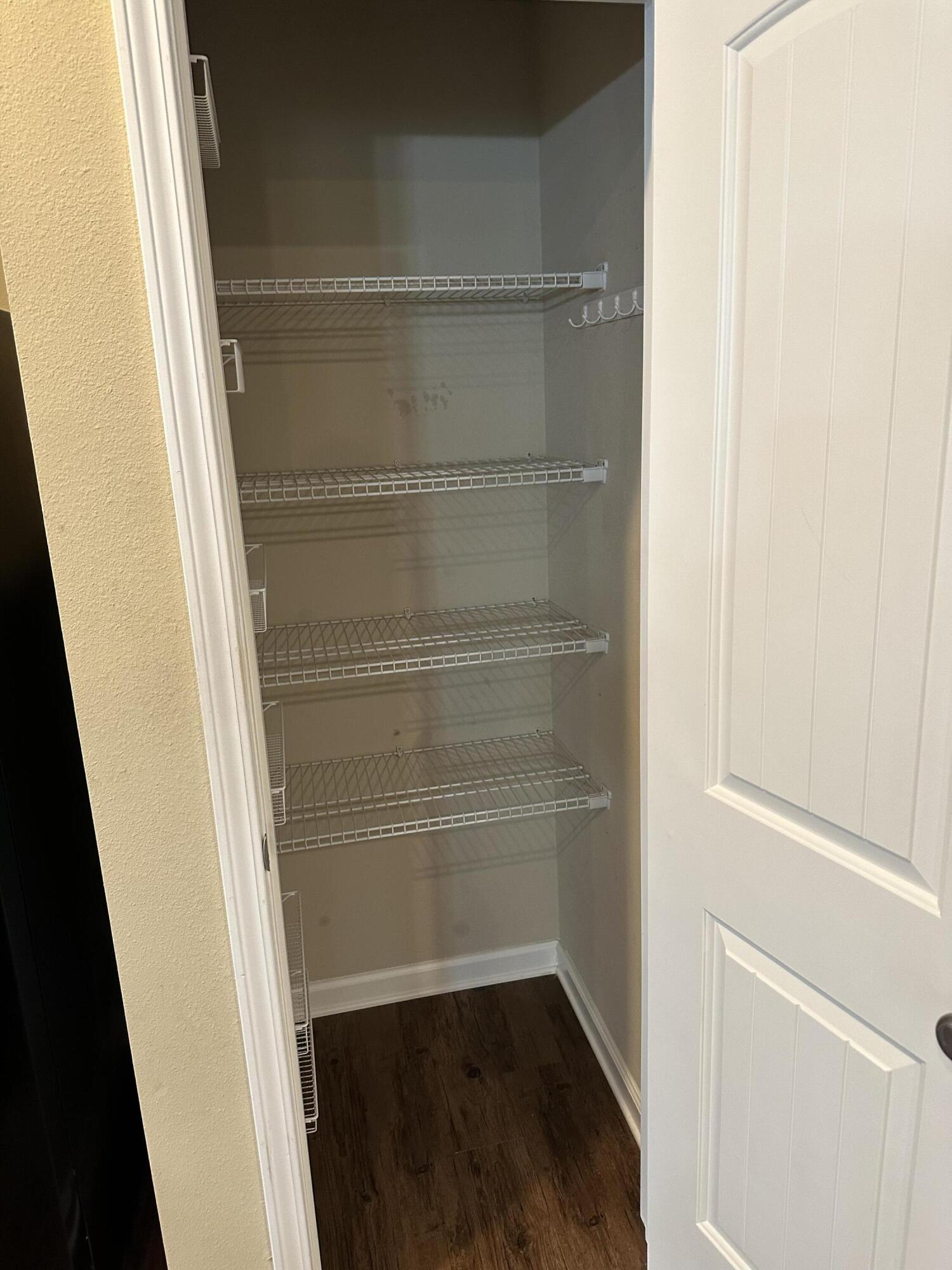 260 Cornelia Street Freeport, FL 32439 - Photo 27 of 31 a view of walk in closet with empty racks