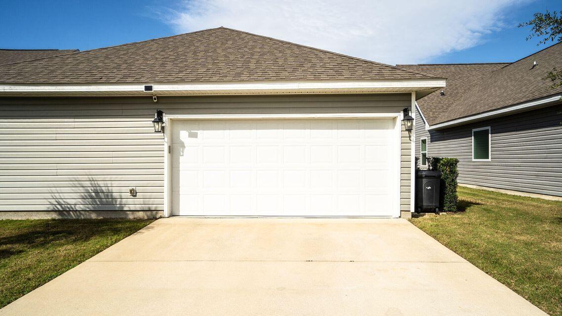 260 Cornelia Street Freeport, FL 32439 - Photo 28 of 31 a view of a house with a garage