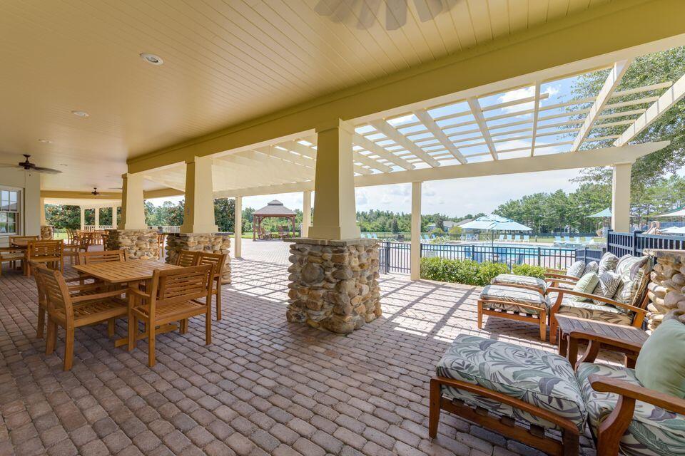 260 Cornelia Street Freeport, FL 32439 - Photo 31 of 31 a living room with furniture and a floor to ceiling window