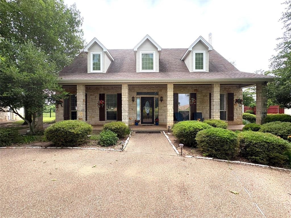 1170 Brazos Loop Gholson, TX 76705 - Photo 6 of 37 Stone exterior featuring a covered front porch with multiple support columns