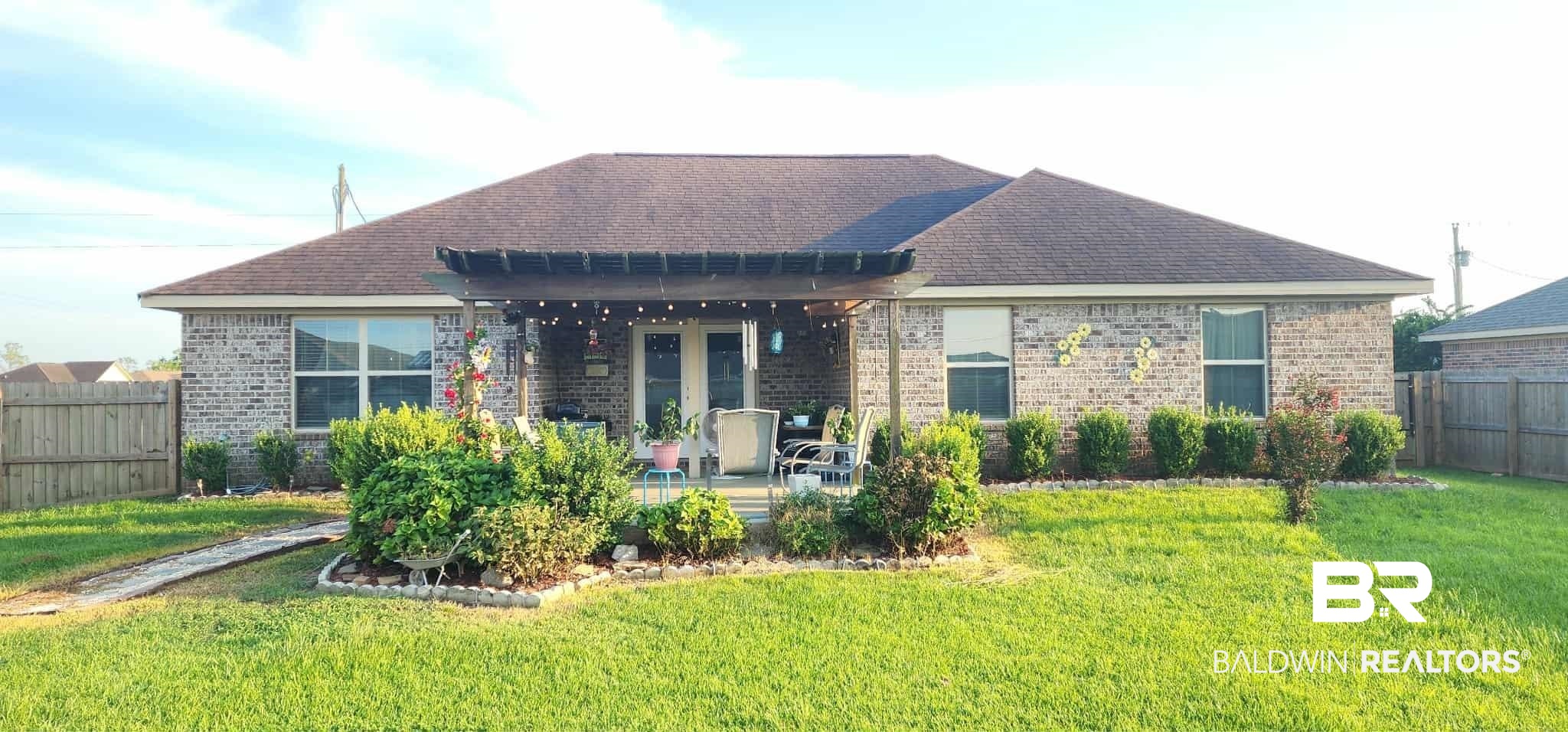 15623 Medway Court Foley, AL 36535 - Photo 4 of 29 Rear view of house with a patio, brick siding, and roof with shingles