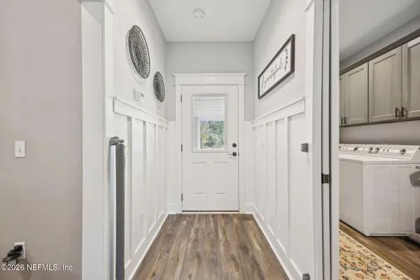 a view of a house with a backyard and porch