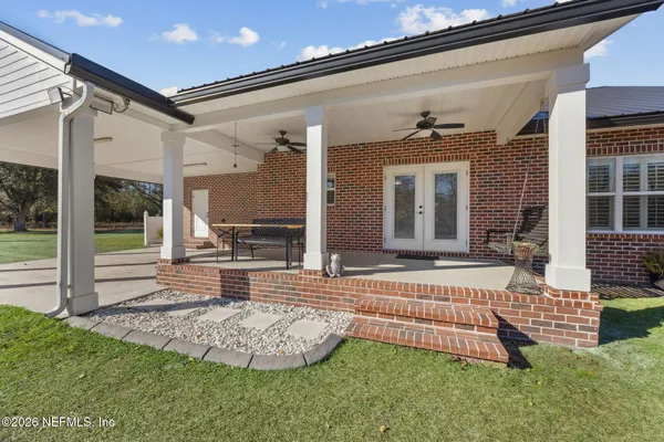 a front view of a house with a garden and porch