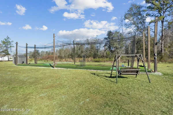 a front view of house with yard and seating space