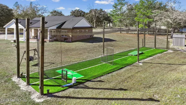 a view of a street with a building in the background