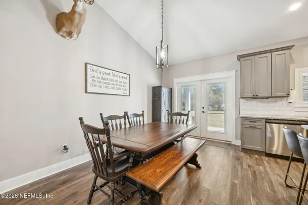 a dining room with furniture and window