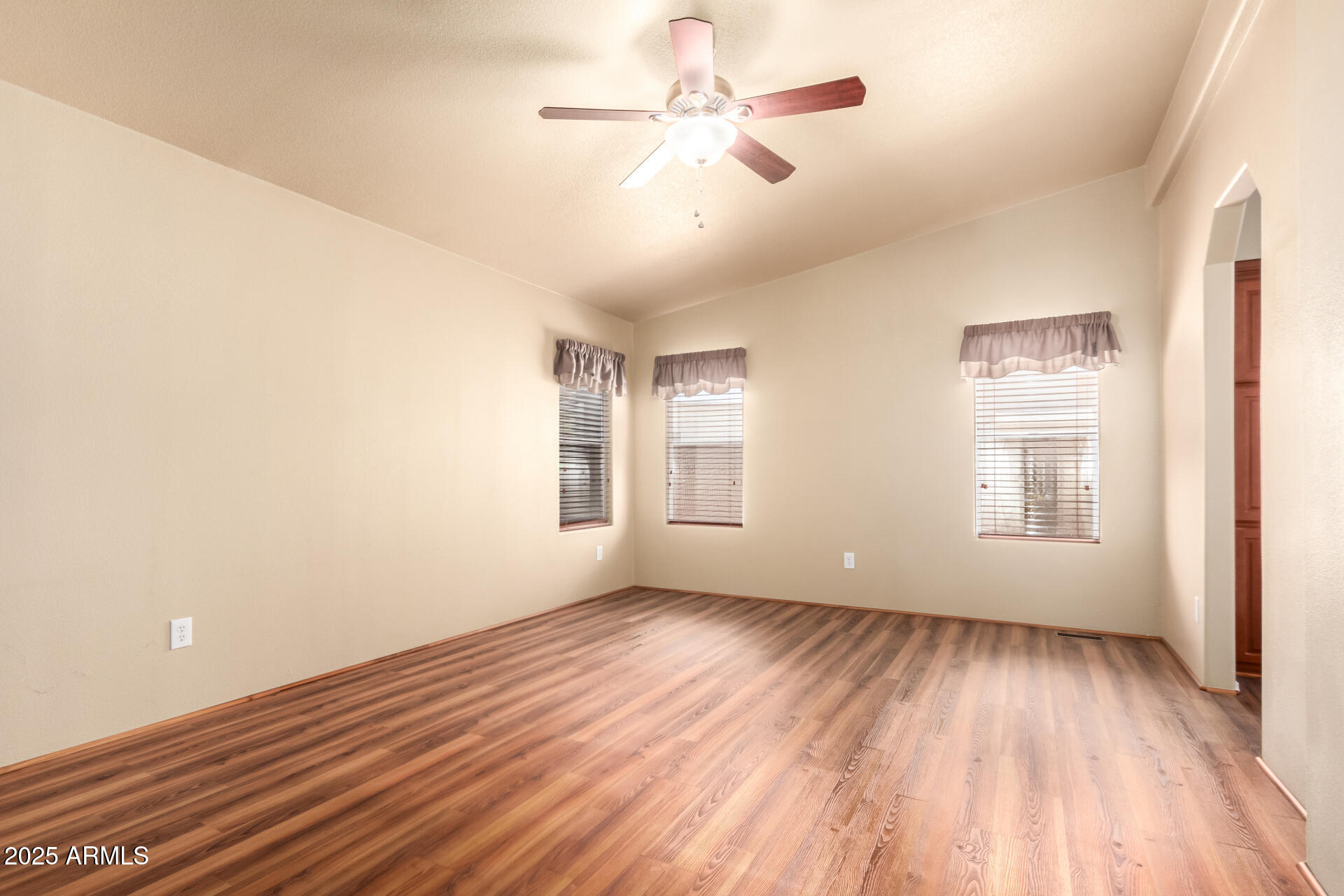 2929 East Main Street, Unit 159 Mesa, AZ 85213 - Photo 15 of 30 wooden floor in an empty room with a window