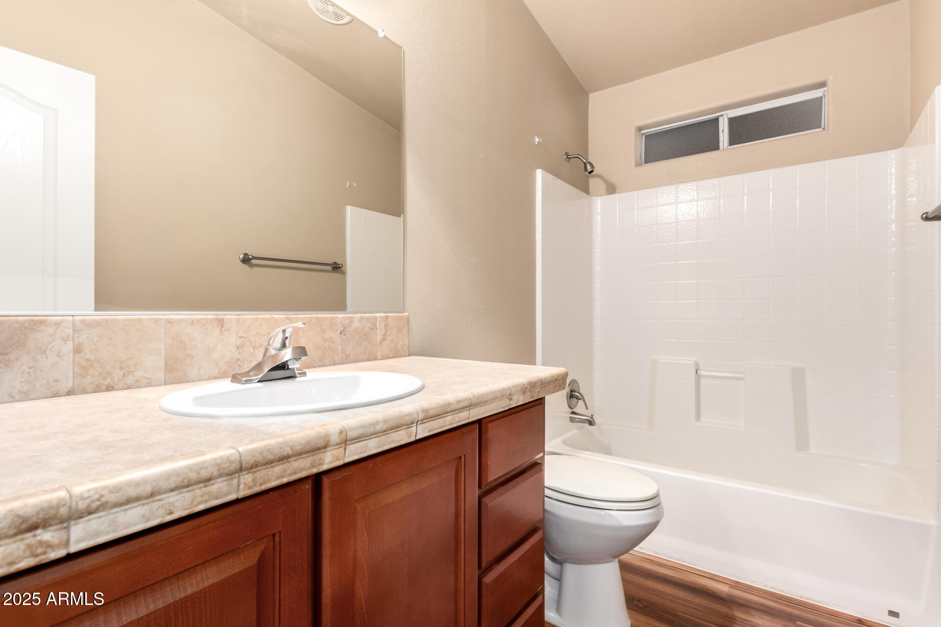2929 East Main Street, Unit 159 Mesa, AZ 85213 - Photo 20 of 30 a bathroom with a granite countertop sink toilet and shower