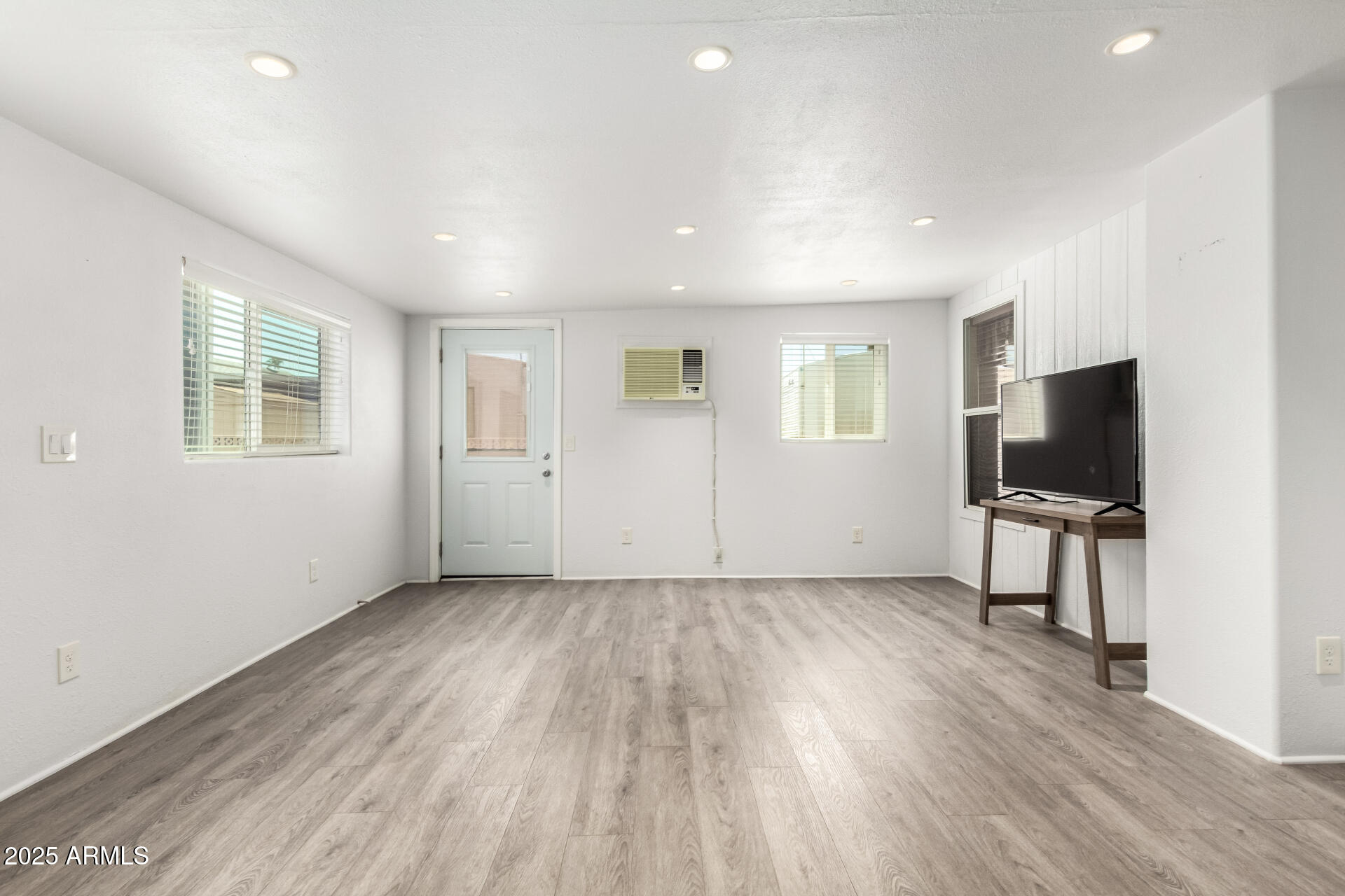 2929 East Main Street, Unit 159 Mesa, AZ 85213 - Photo 24 of 30 wooden floor in an empty room with a window