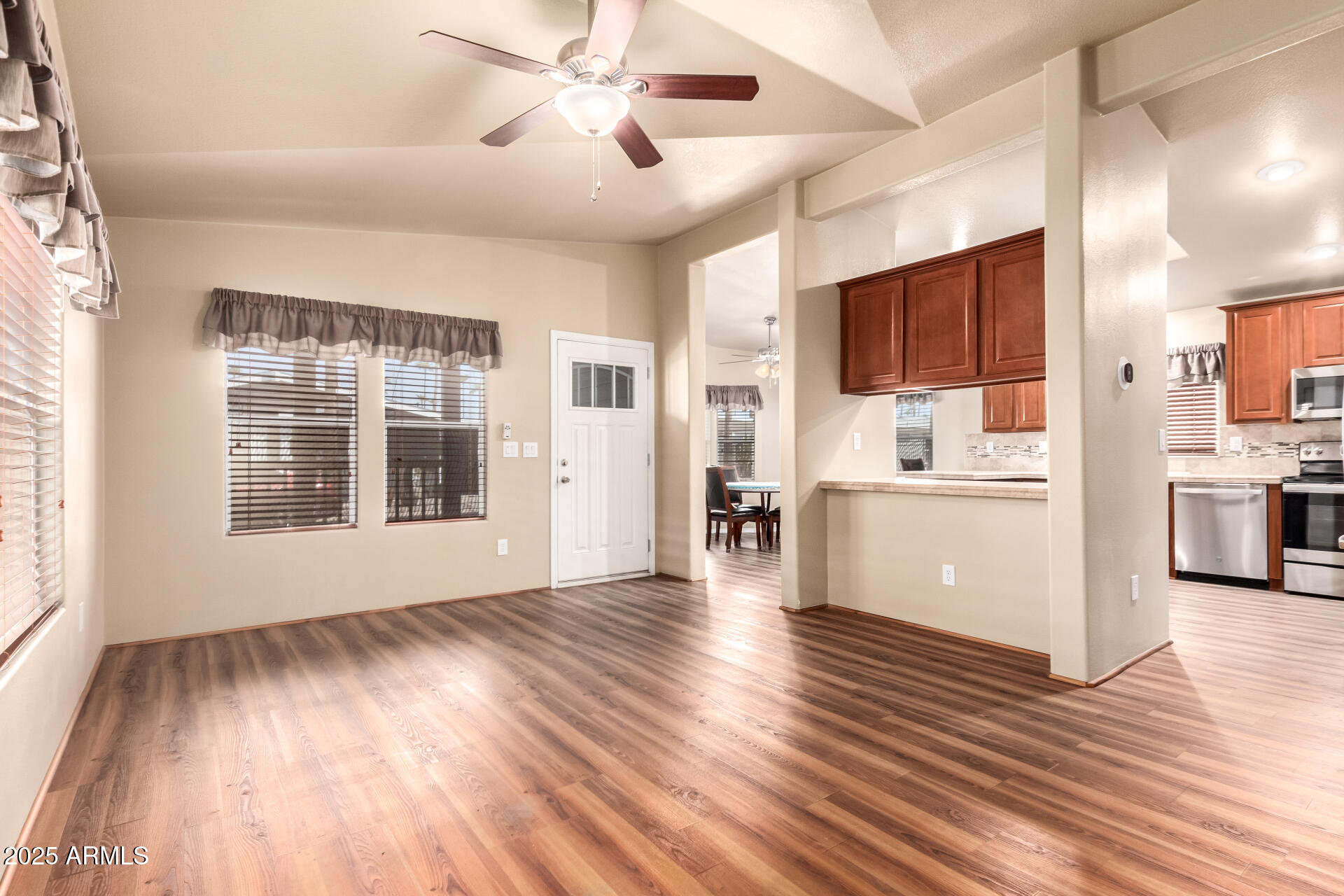 2929 East Main Street, Unit 159 Mesa, AZ 85213 - Photo 5 of 30 a view of empty room with wooden floor and window