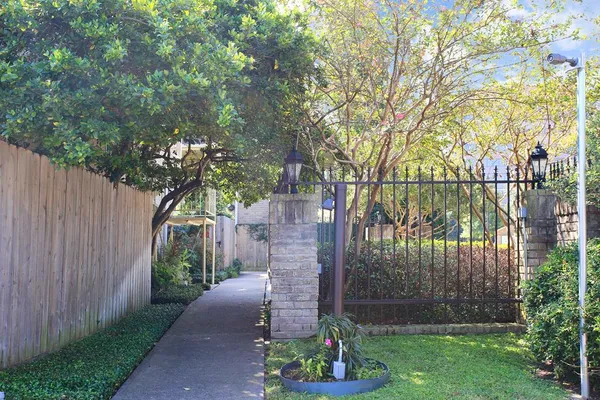 a view of a pathway with a yard