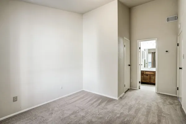 an empty room with a bathroom