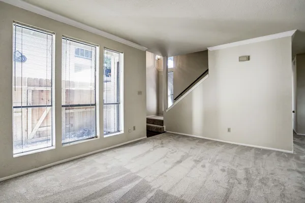 a view of an empty room with a window
