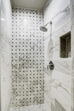 a bathroom with a sink and a shower