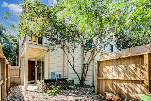a view of a house with a tree