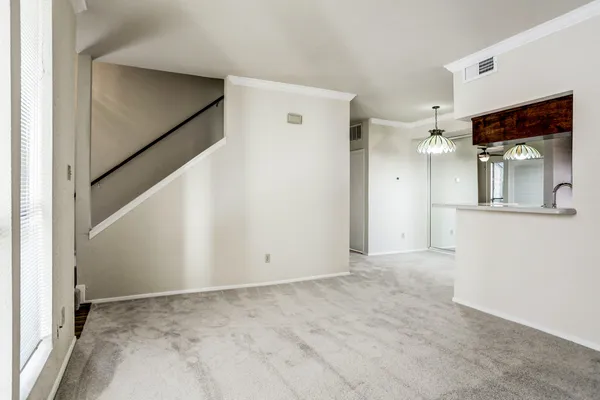 a view of a hallway to a bedroom and bathroom