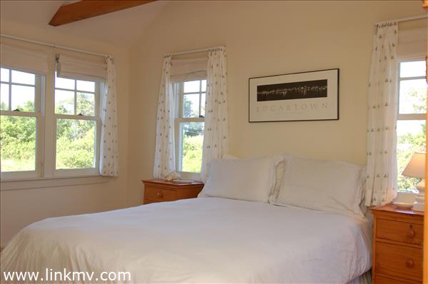 25 Basin Road Chilmark, MA 02535 - Photo 9 of 11 a bedroom with a bed and a window