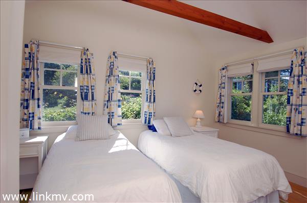 25 Basin Road Chilmark, MA 02535 - Photo 10 of 11 a bedroom with furniture and large windows
