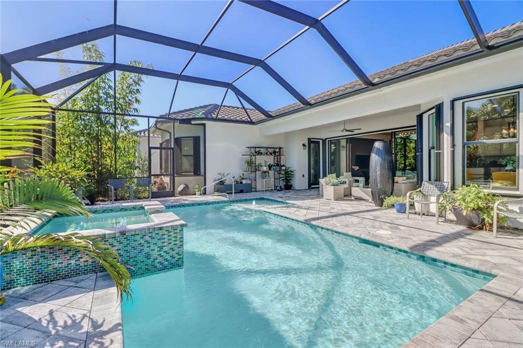 4617 Azalea Drive Naples, FL 34119 - Photo 23 of 34 a view of a backyard with patio