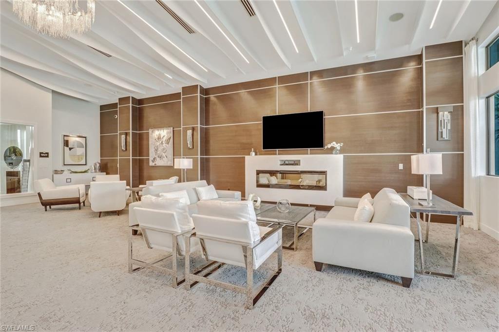 4617 Azalea Drive Naples, FL 34119 - Photo 31 of 34 a living room with furniture and a flat screen tv