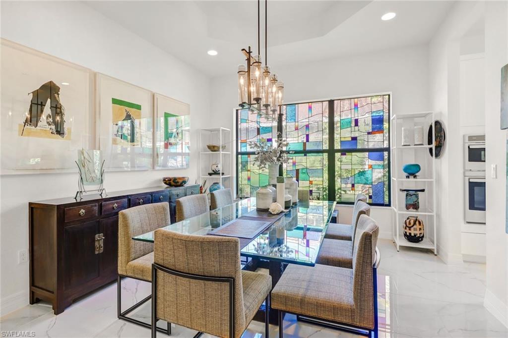 4617 Azalea Drive Naples, FL 34119 - Photo 6 of 34 a living room with furniture and a window