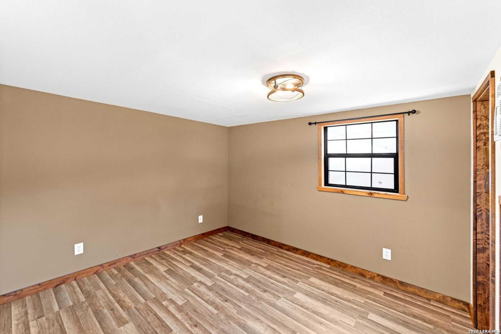 297 Chaparral Drive Bandera, TX 78003 - Photo 3 of 19 an empty room with windows