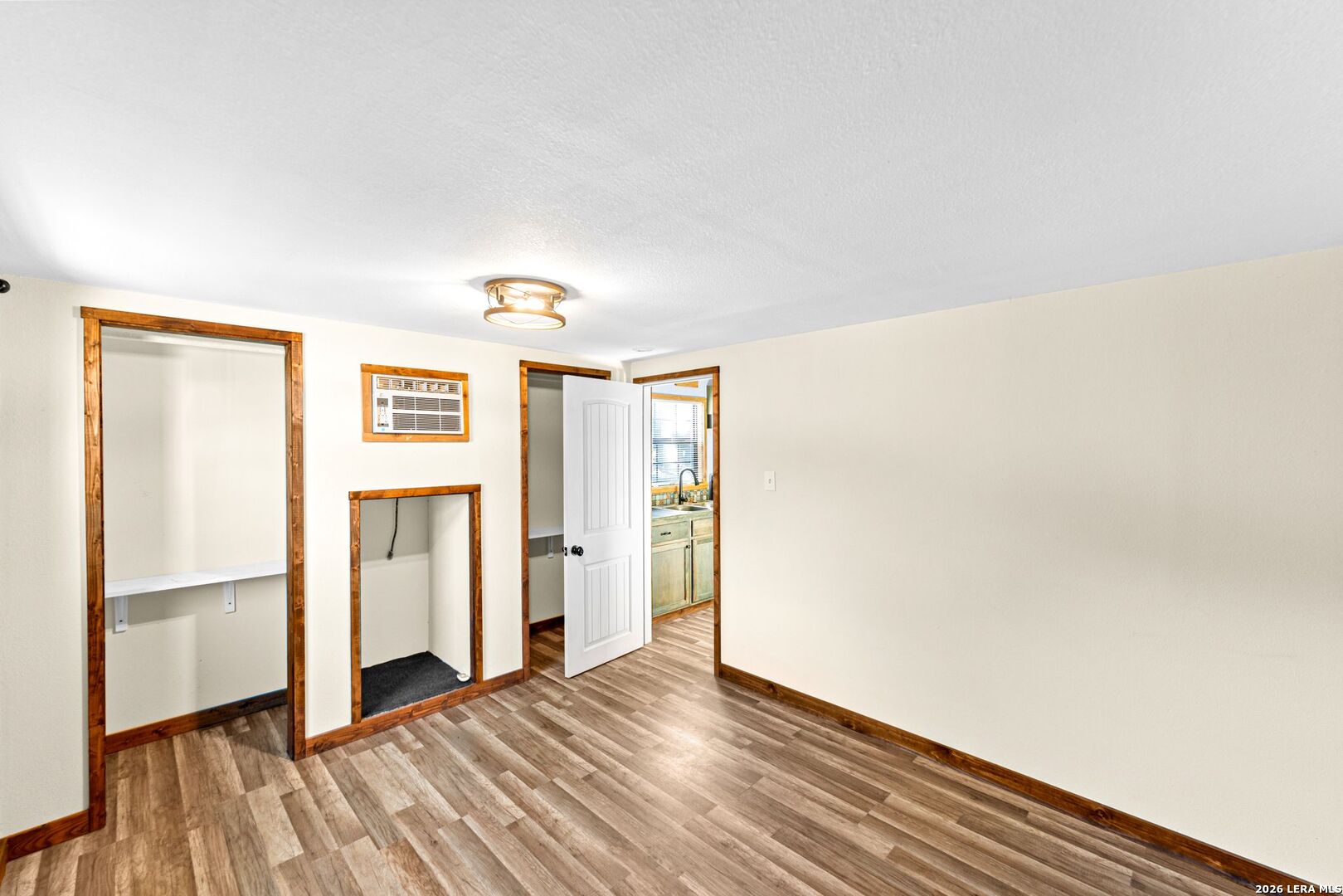 297 Chaparral Drive Bandera, TX 78003 - Photo 4 of 19 a view of hallway with wooden floor
